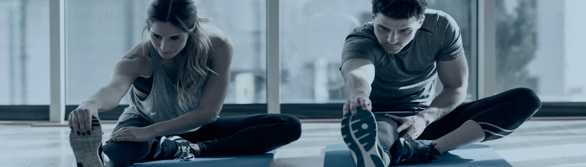 Billede af mennesker der strækker ud